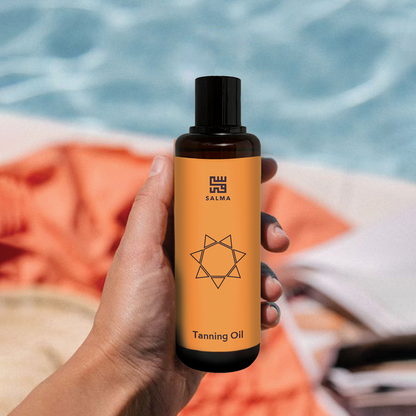Bottle of Salma Loves Beauty tanning oil for shimmer and hydration