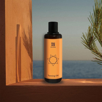 Bottle of Salma Loves Beauty tanning oil for shimmer and hydration